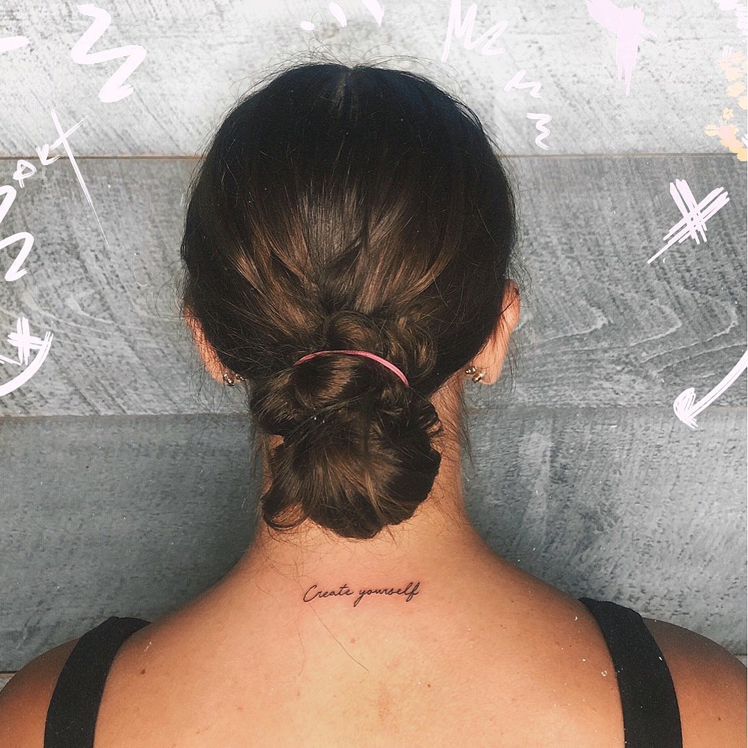 Inspirational quote tattoo on the neck