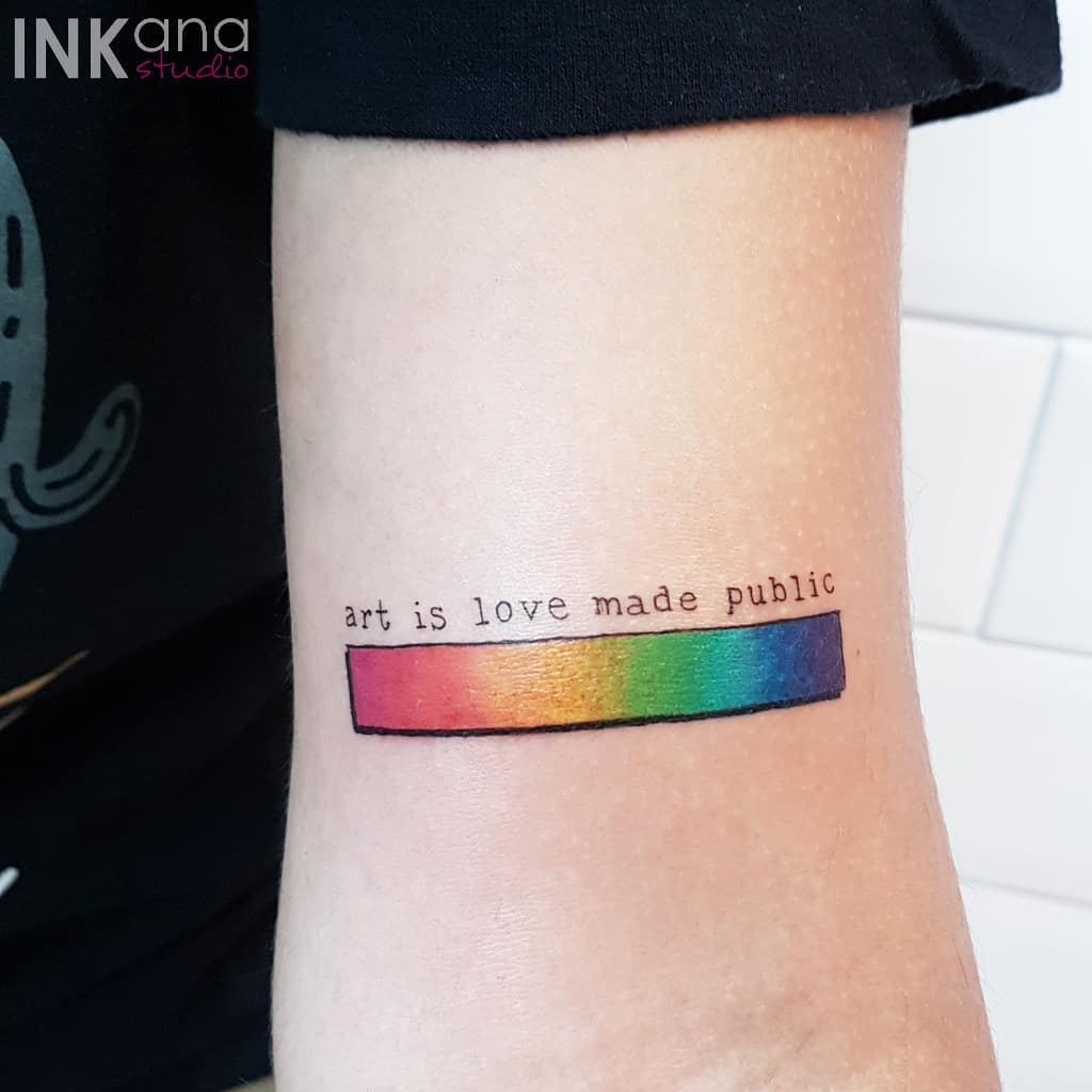 Colorful quote tattoo showcasing artistic expression