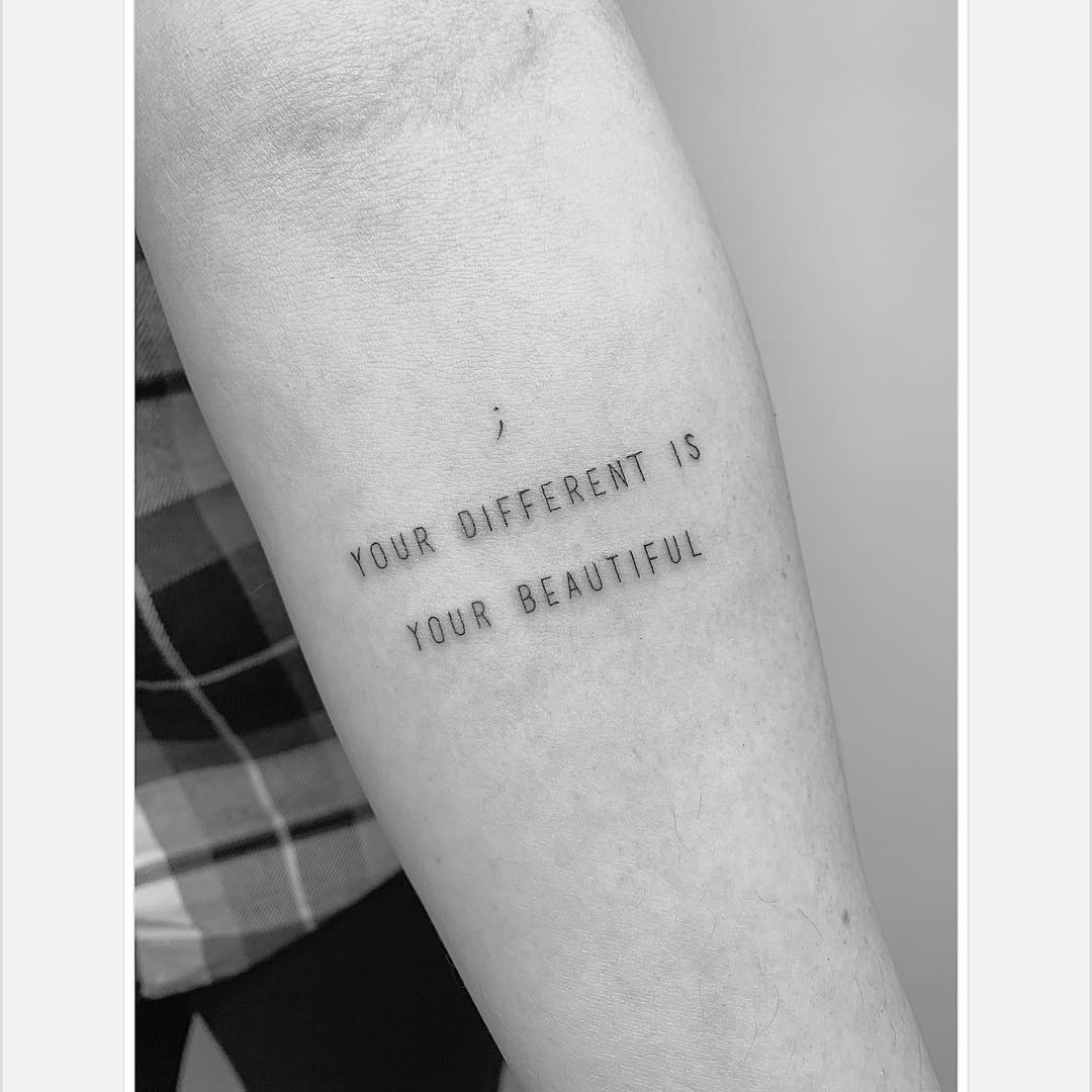 Embrace uniqueness with this powerful quote tattoo.