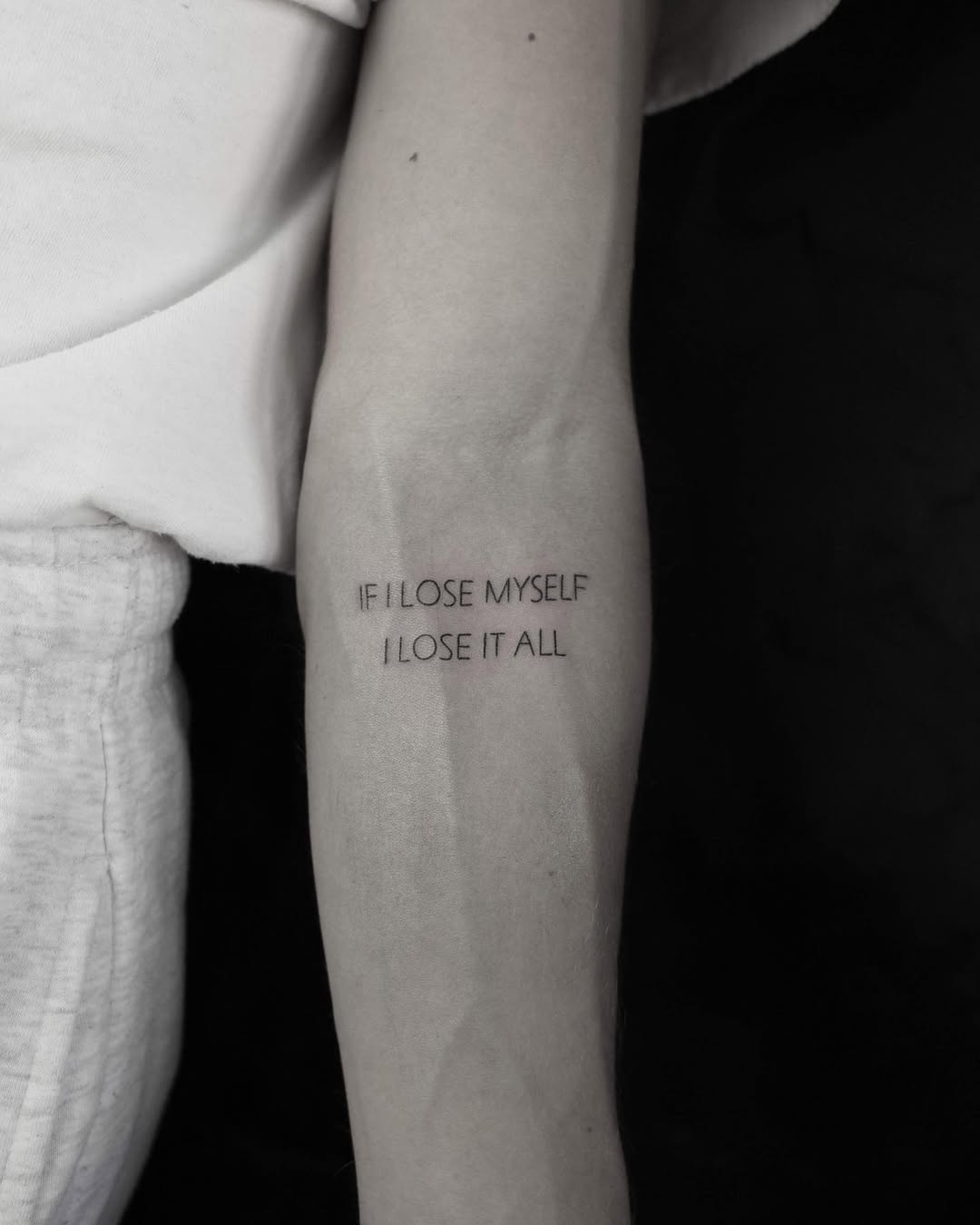 Meaningful quote tattoo capturing self-identity struggle