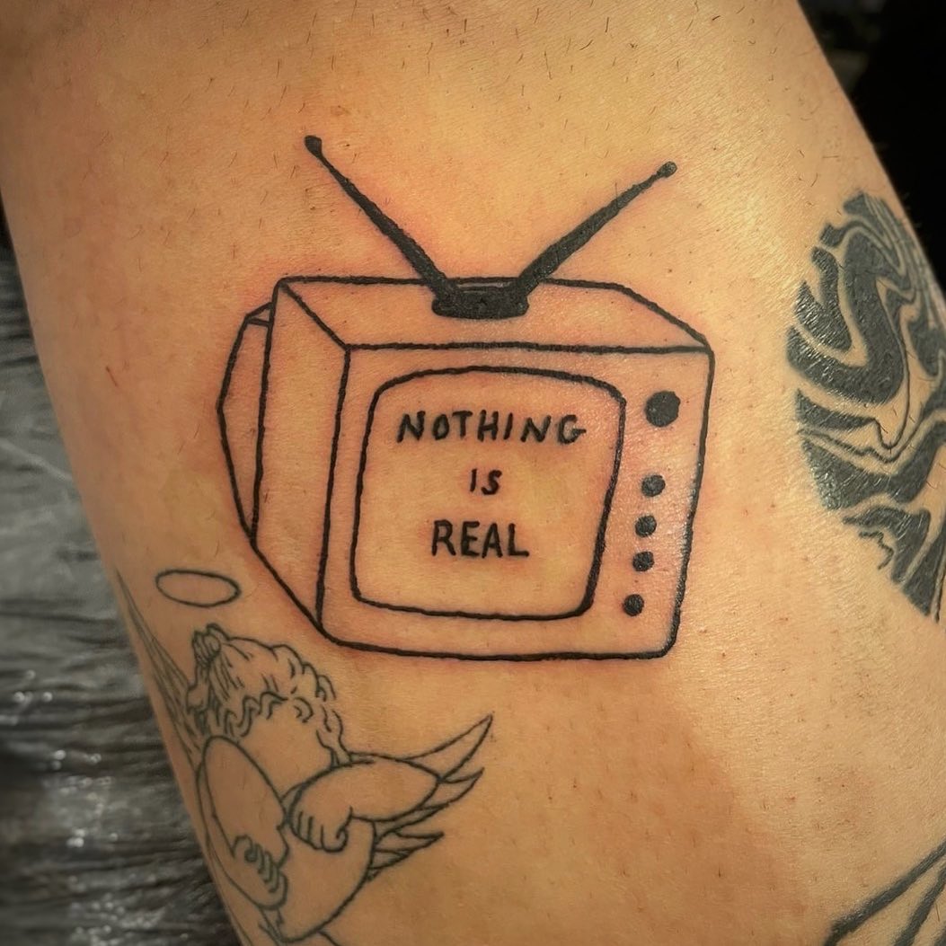 Playful tattoo challenging reality with humor