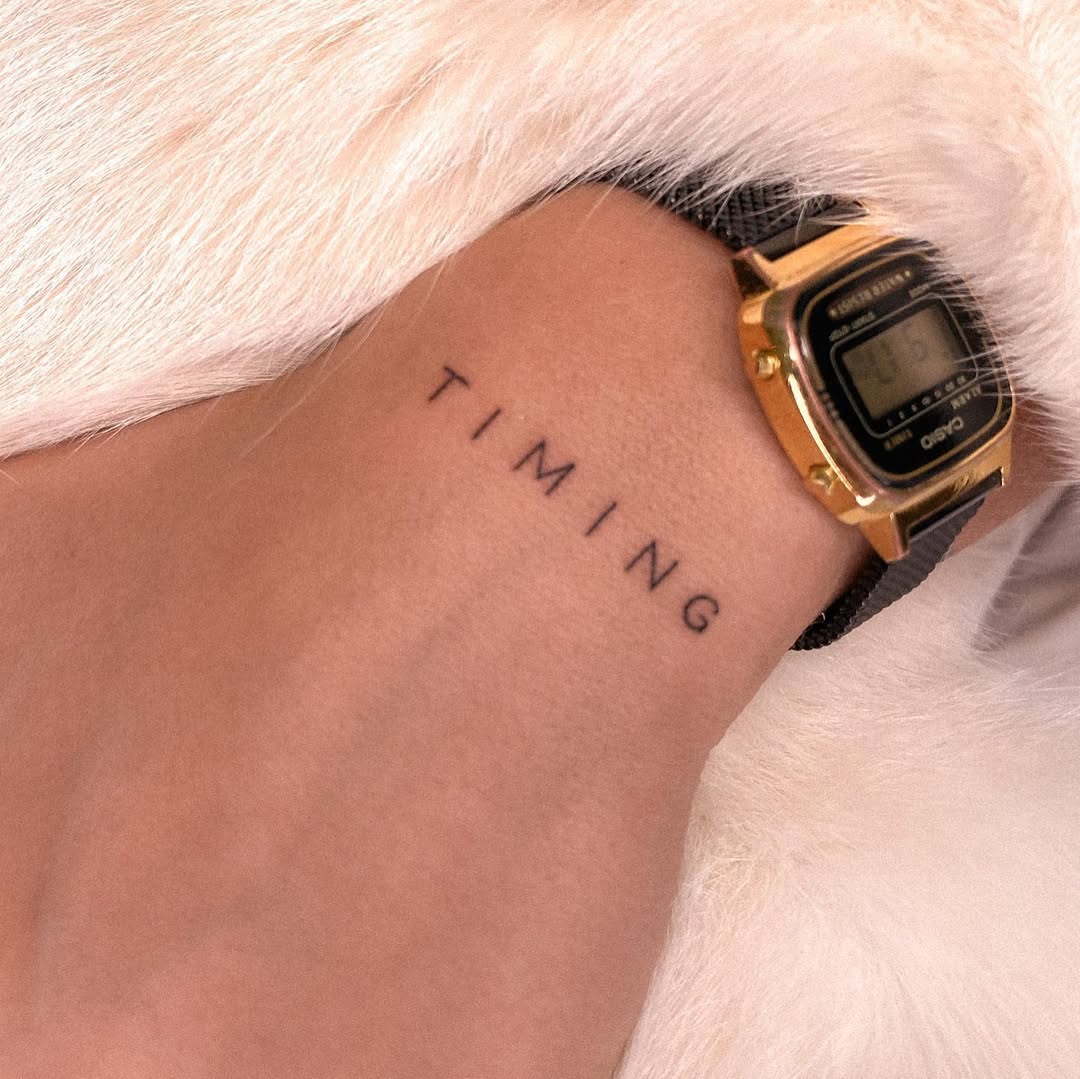 Minimalistic tattoo embodying the essence of timing