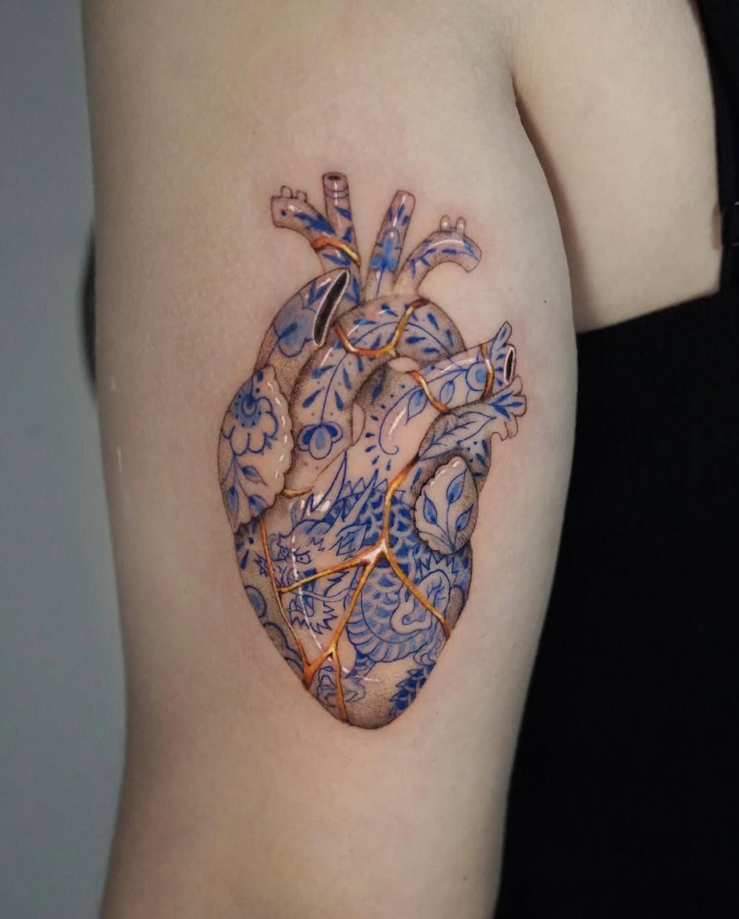 Kintsugi heart tattoo showcasing intricate designs