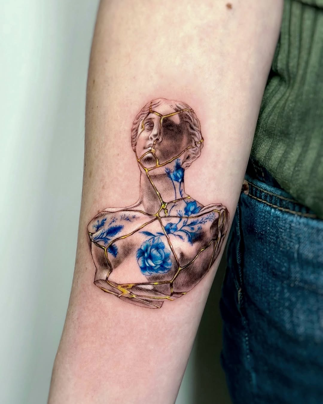 Elegant Kintsugi Tattoo on Classical Sculpture