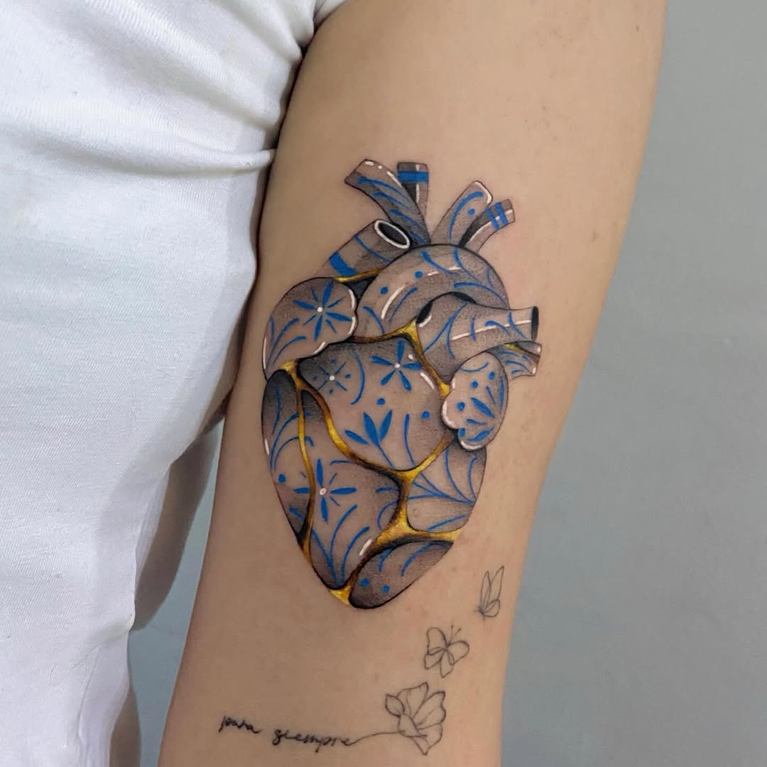 Artful heart tattoo with kintsugi elements