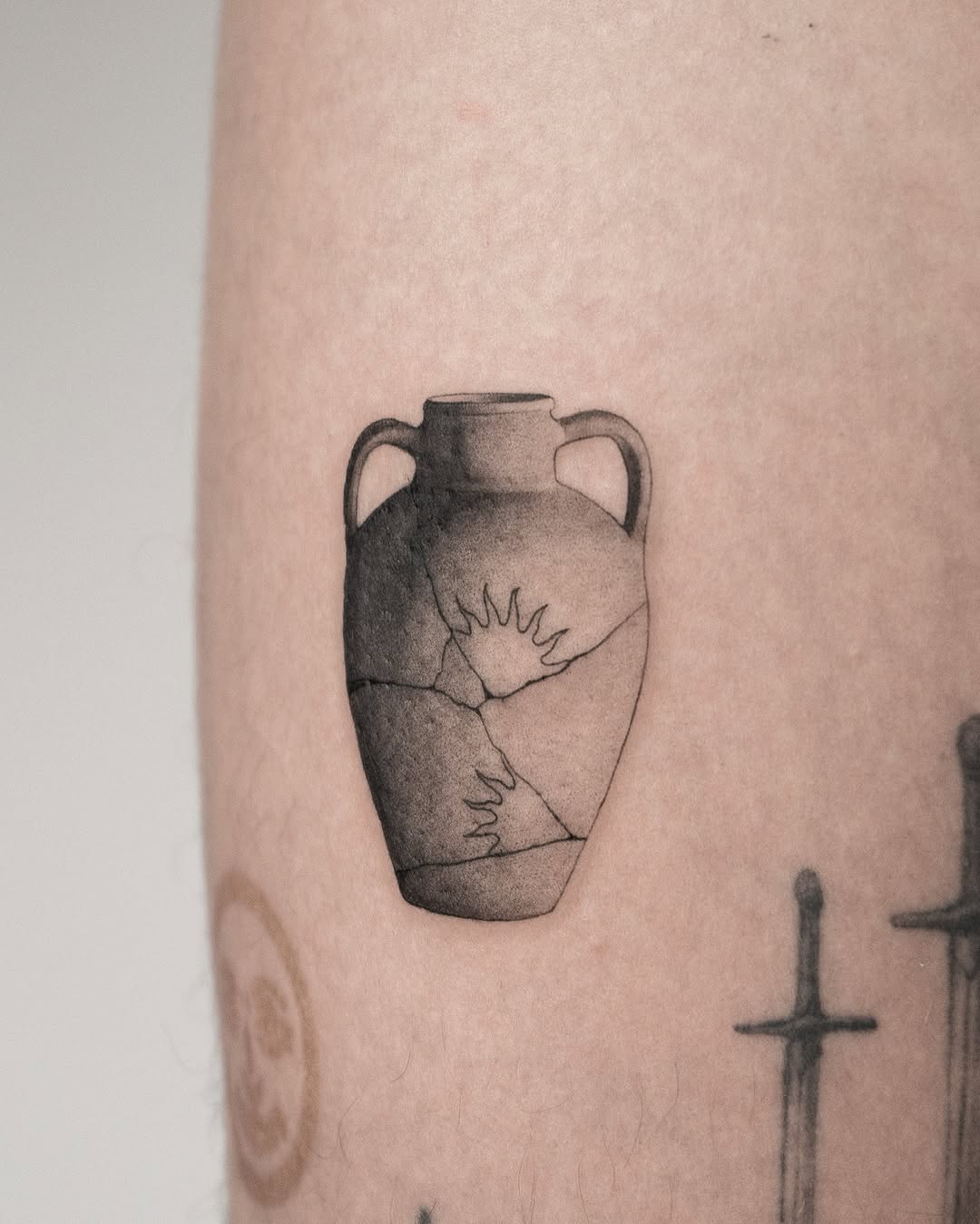 Artfully mended vase tattoo symbolizing resilience