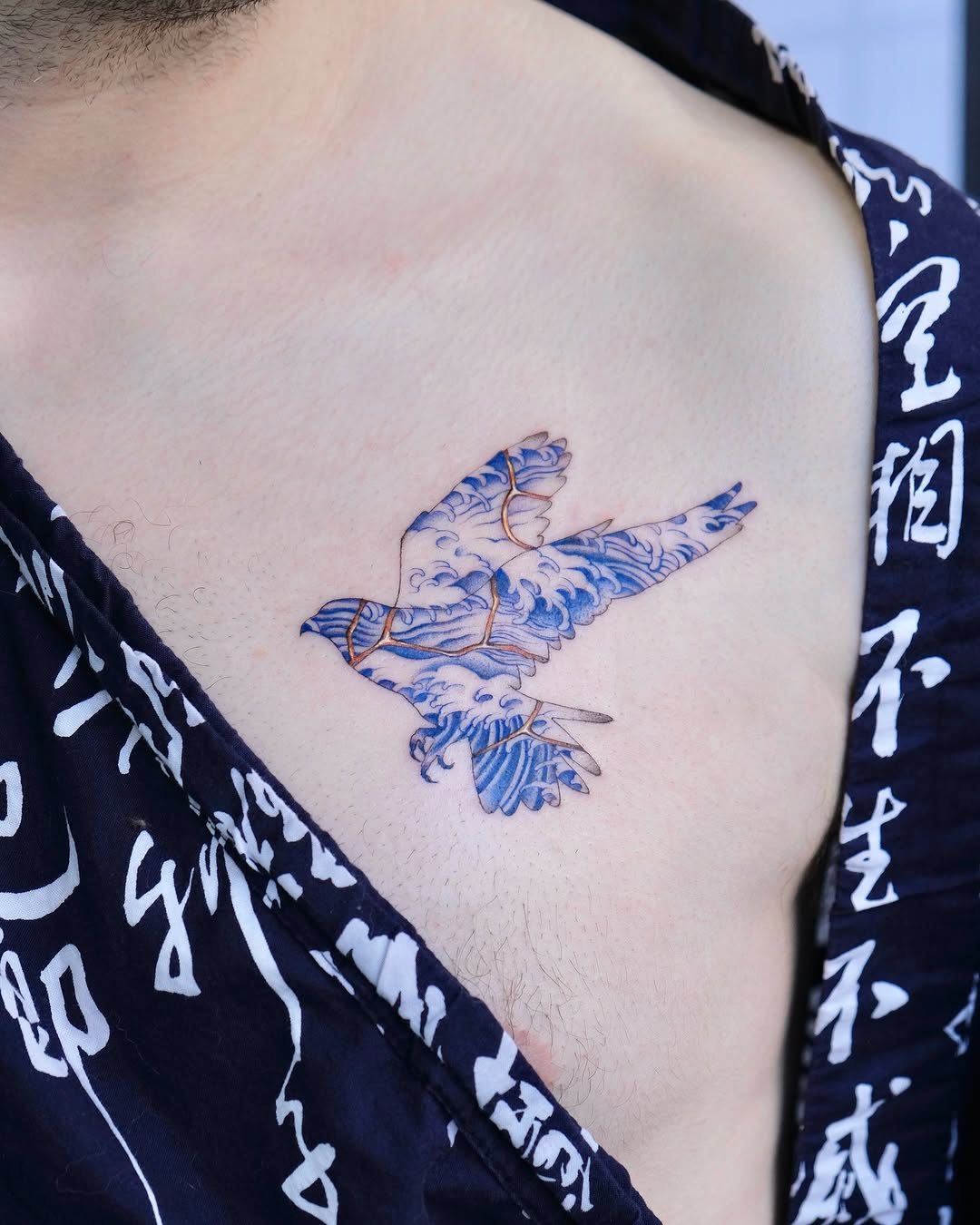 Elegant bird tattoo showcasing kintsugi artistry