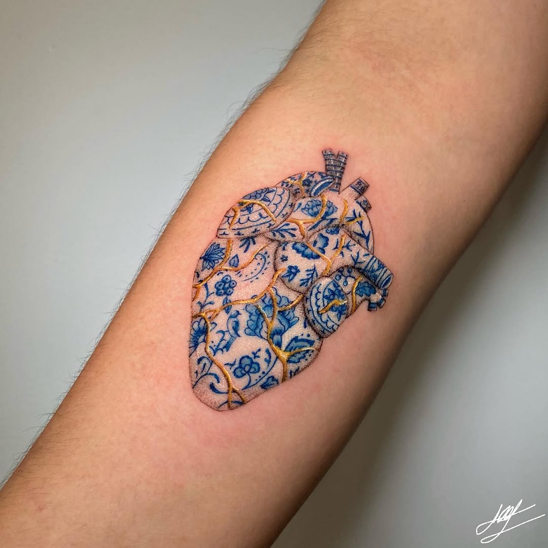 Intricate heart tattoo with kintsugi details