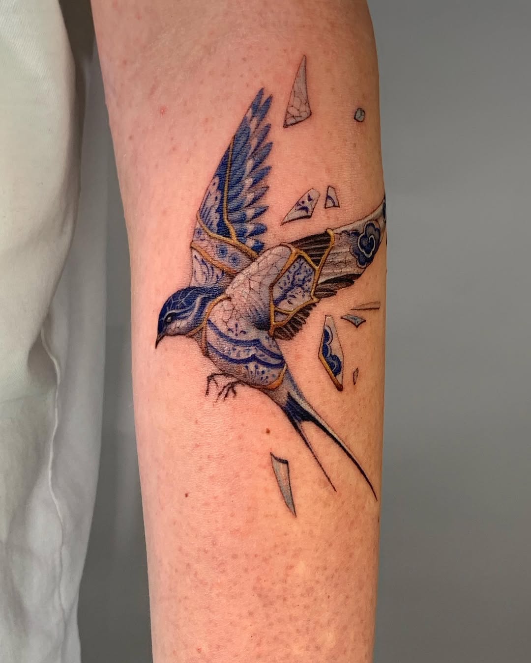 Elegant bird tattoo with kintsugi style