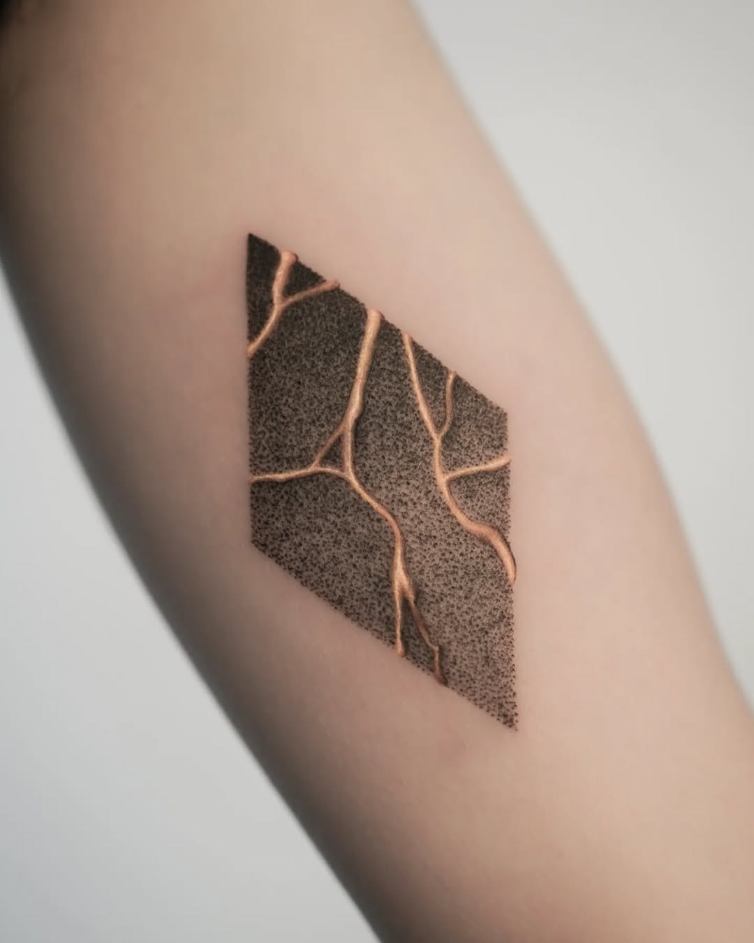 Geometric Kintsugi Tattoo with Golden Details