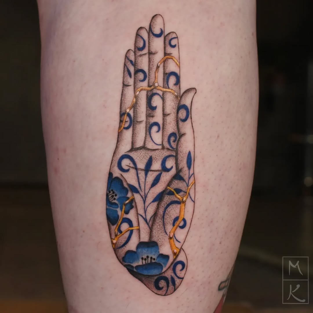 Artistic Kintsugi Hand Tattoo with Floral Elements