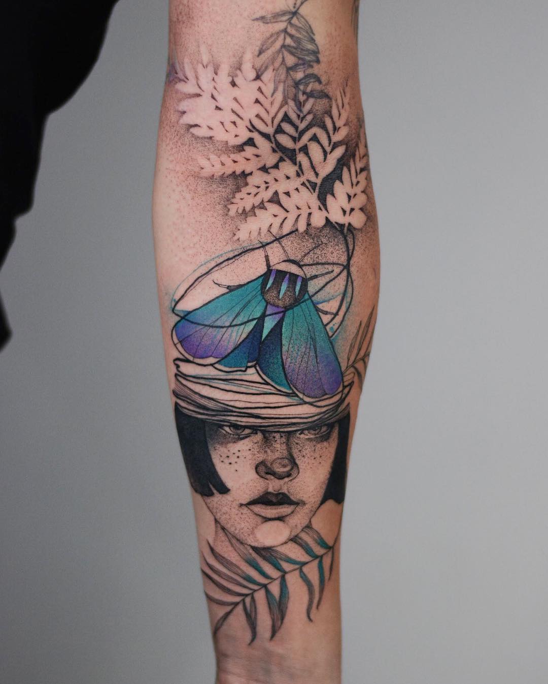 Intricate woman sleeve tattoo with vibrant colors