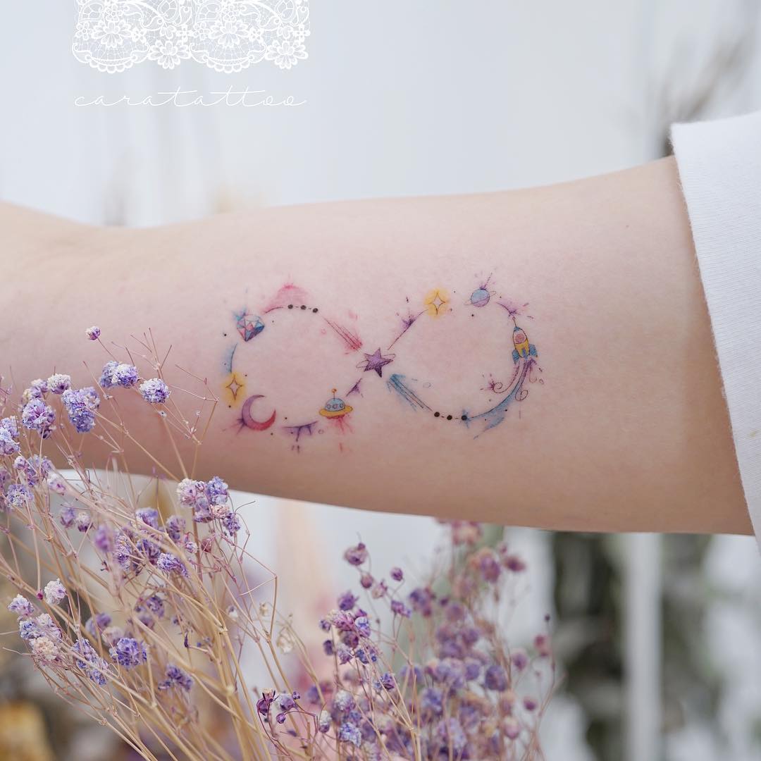 Whimsical infinity tattoo with celestial elements