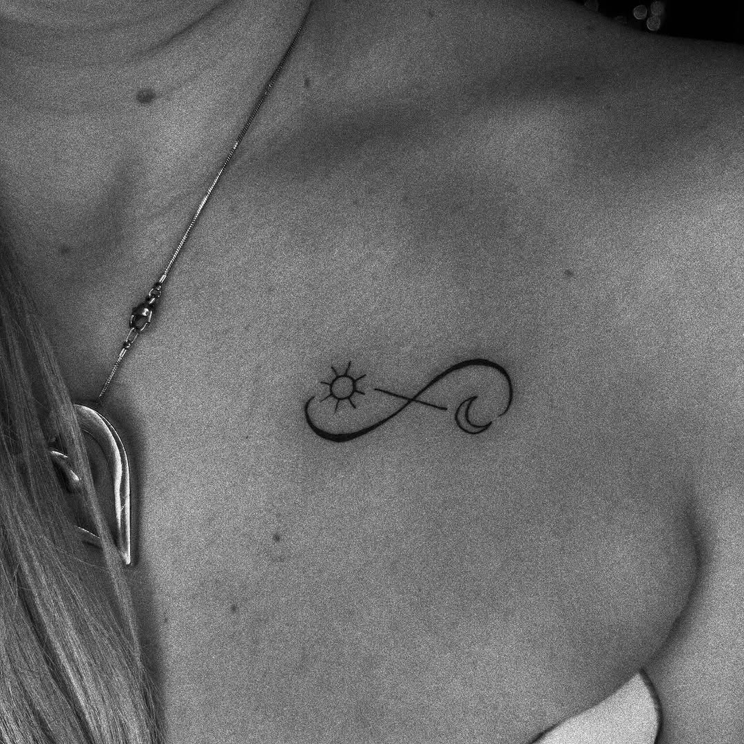 Elegant infinity tattoo with sun and wave