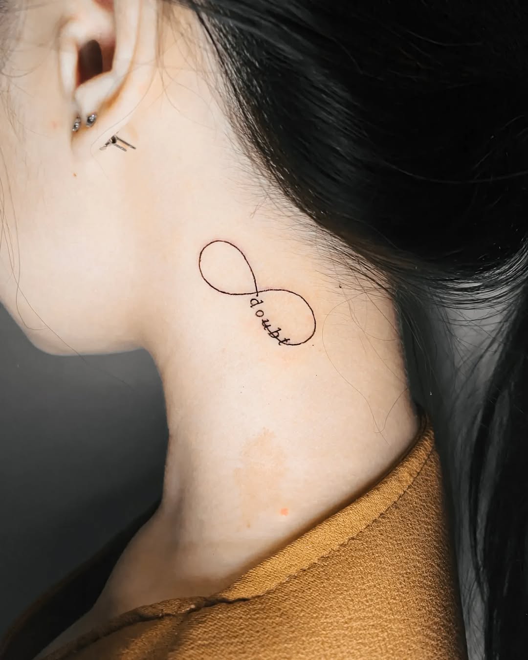 Elegant infinity tattoo with a personal touch