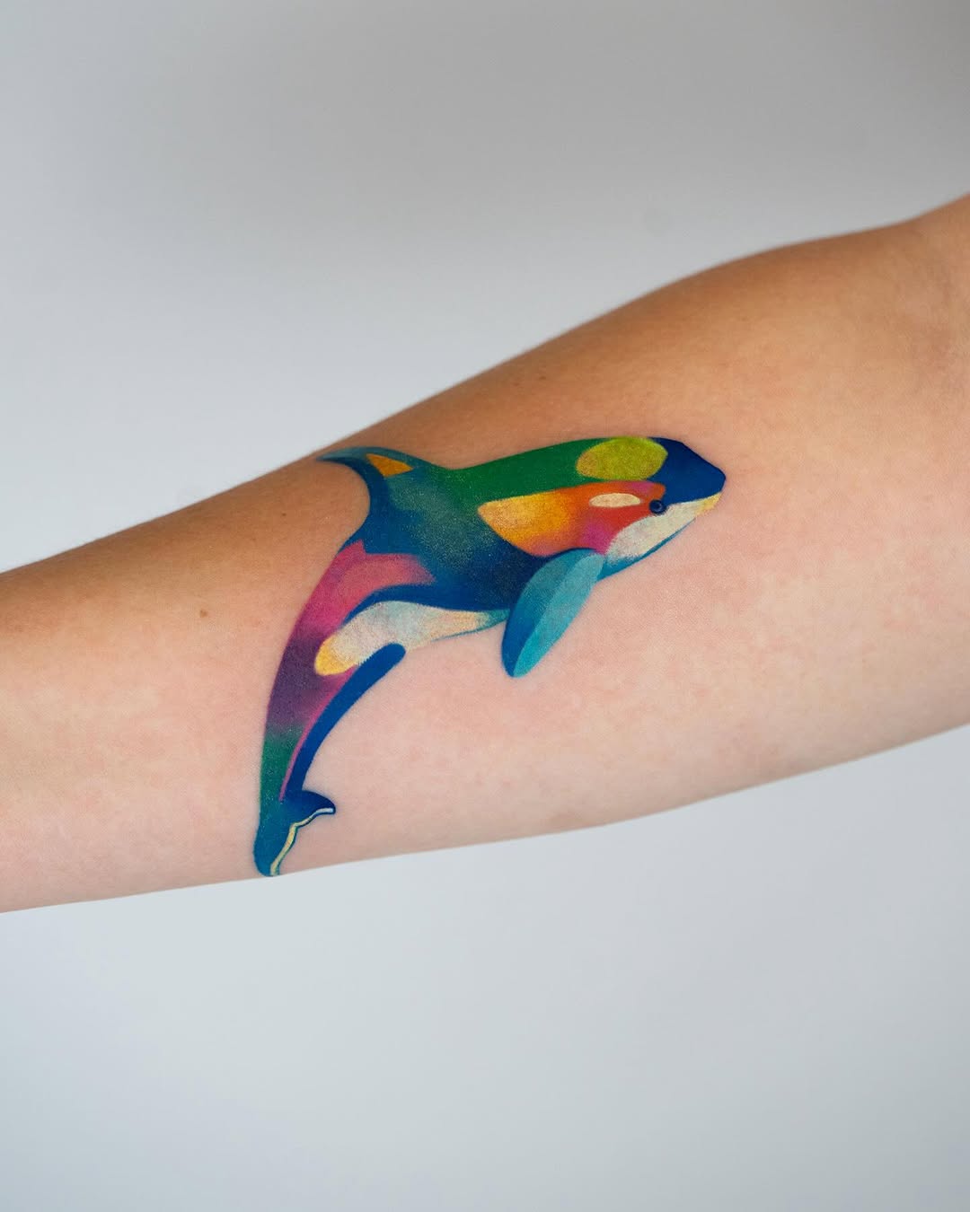 Vibrant dolphin tattoo that captures the ocean