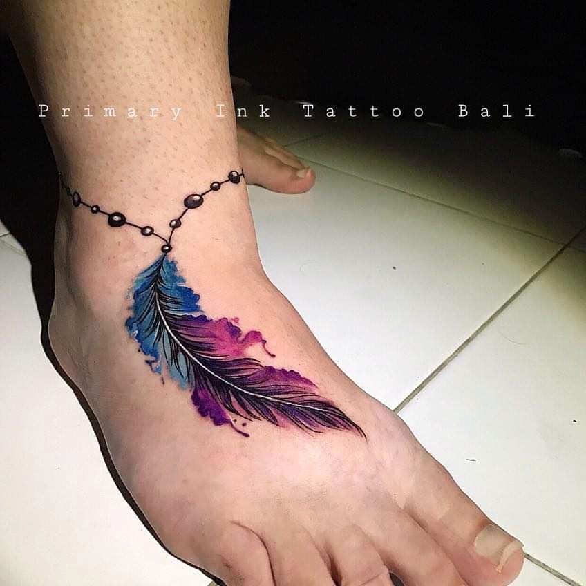 Vibrant Feather Tattoo with Intricate Details