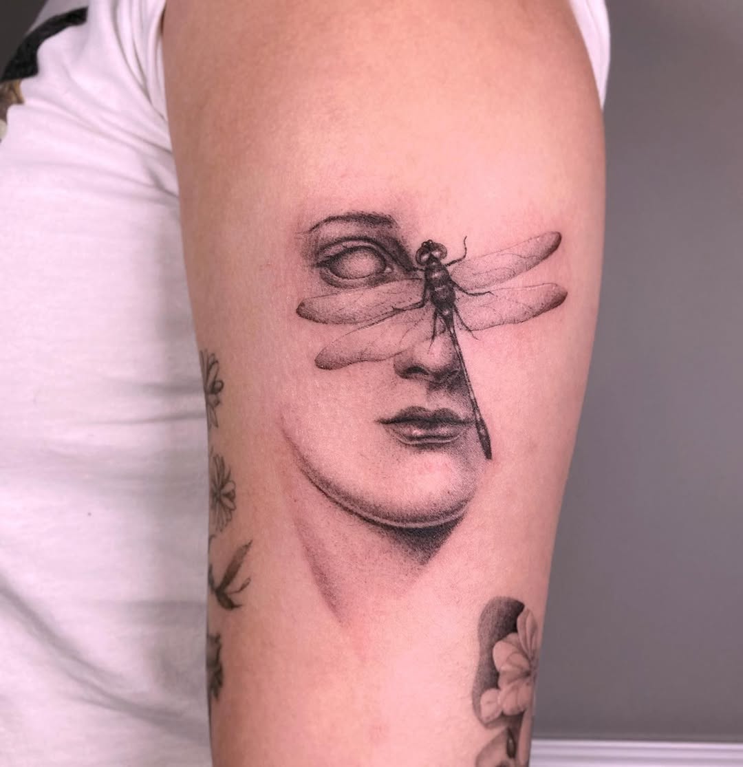 Elegant dragonfly tattoo merging beauty and art