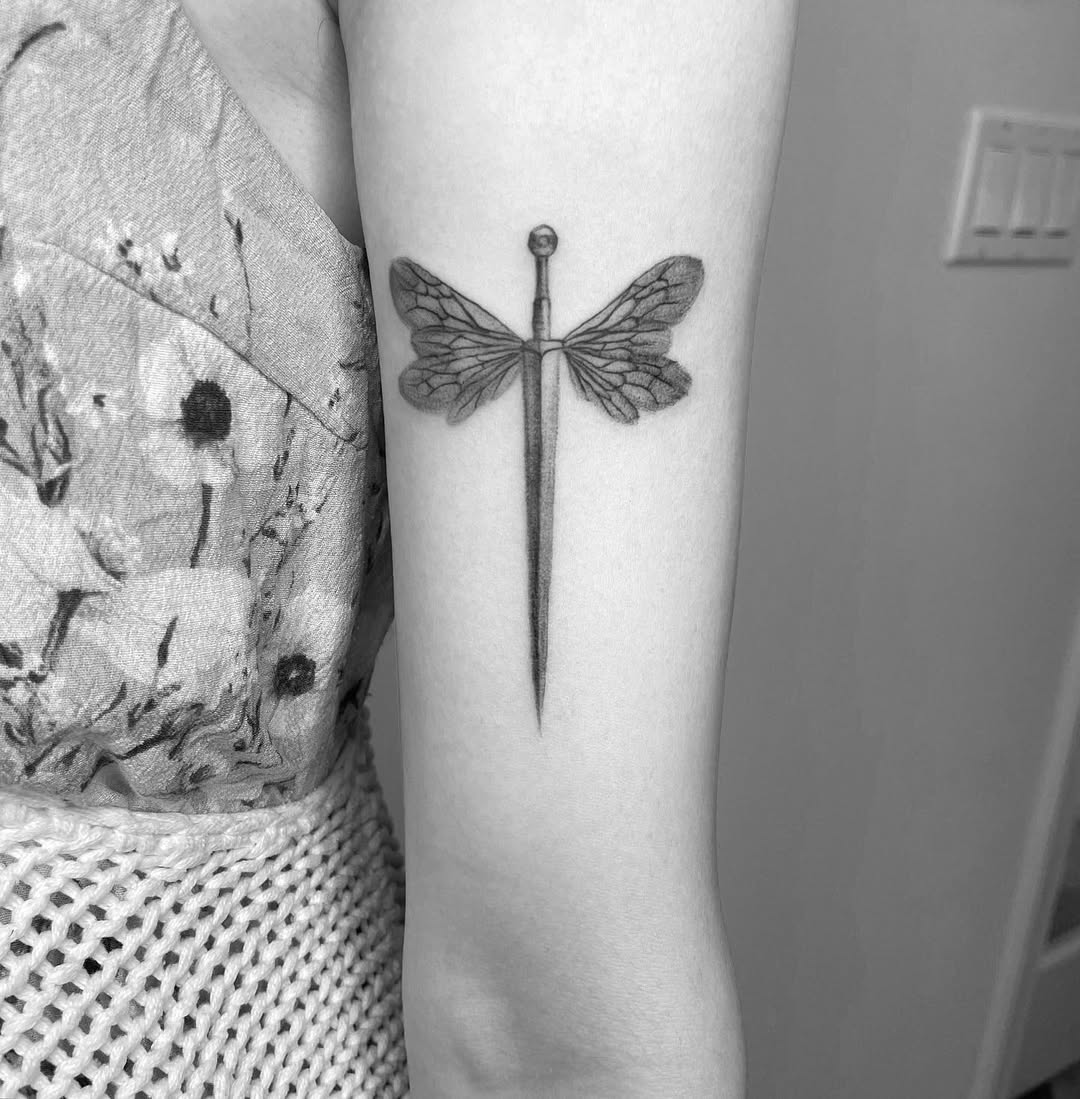 Elegant black and white dragonfly tattoo design