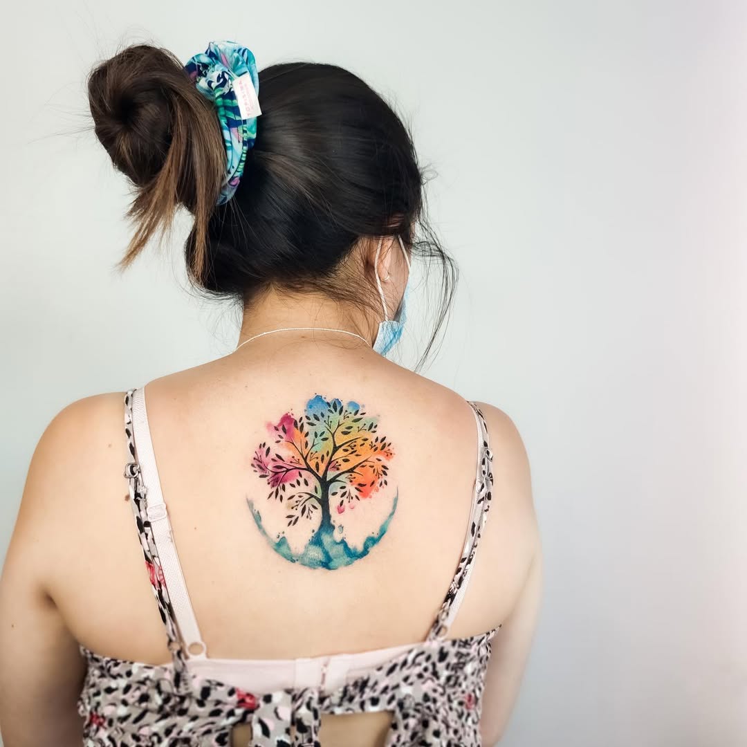 Vibrant tree of life tattoo in watercolor style