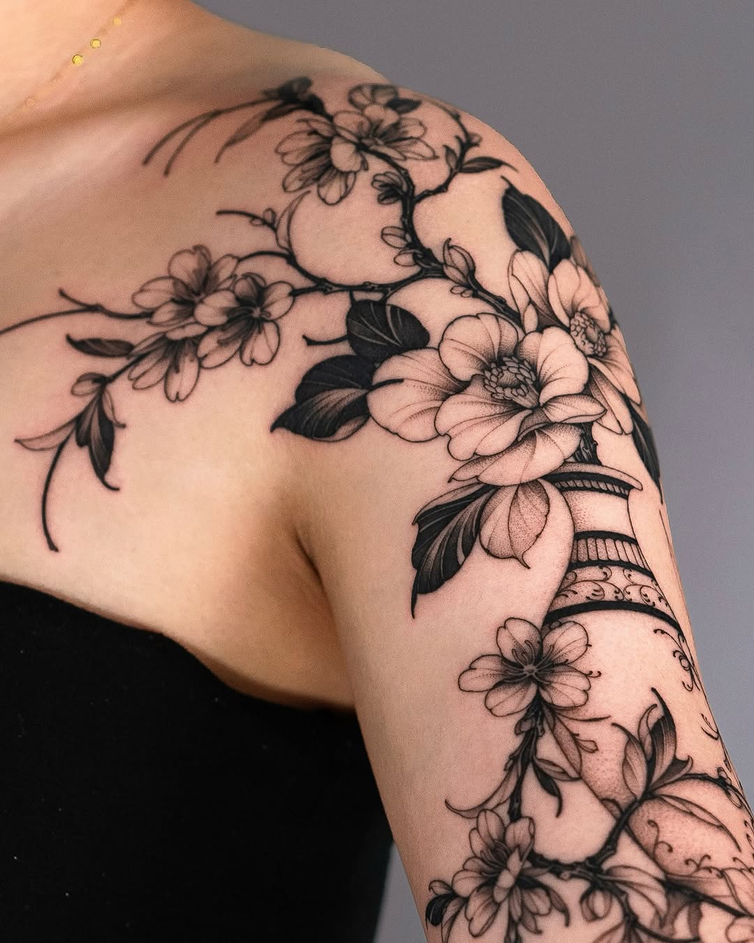 Elegant floral tattoo design on the arm