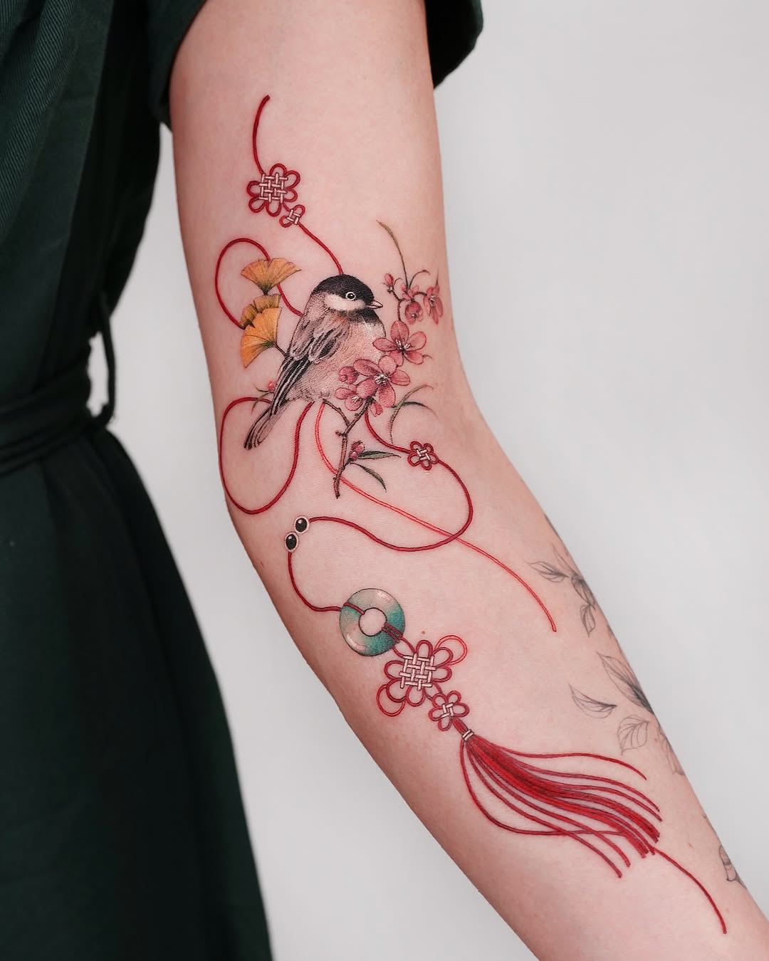 Elegant bird surrounded by floral elements and ribbons