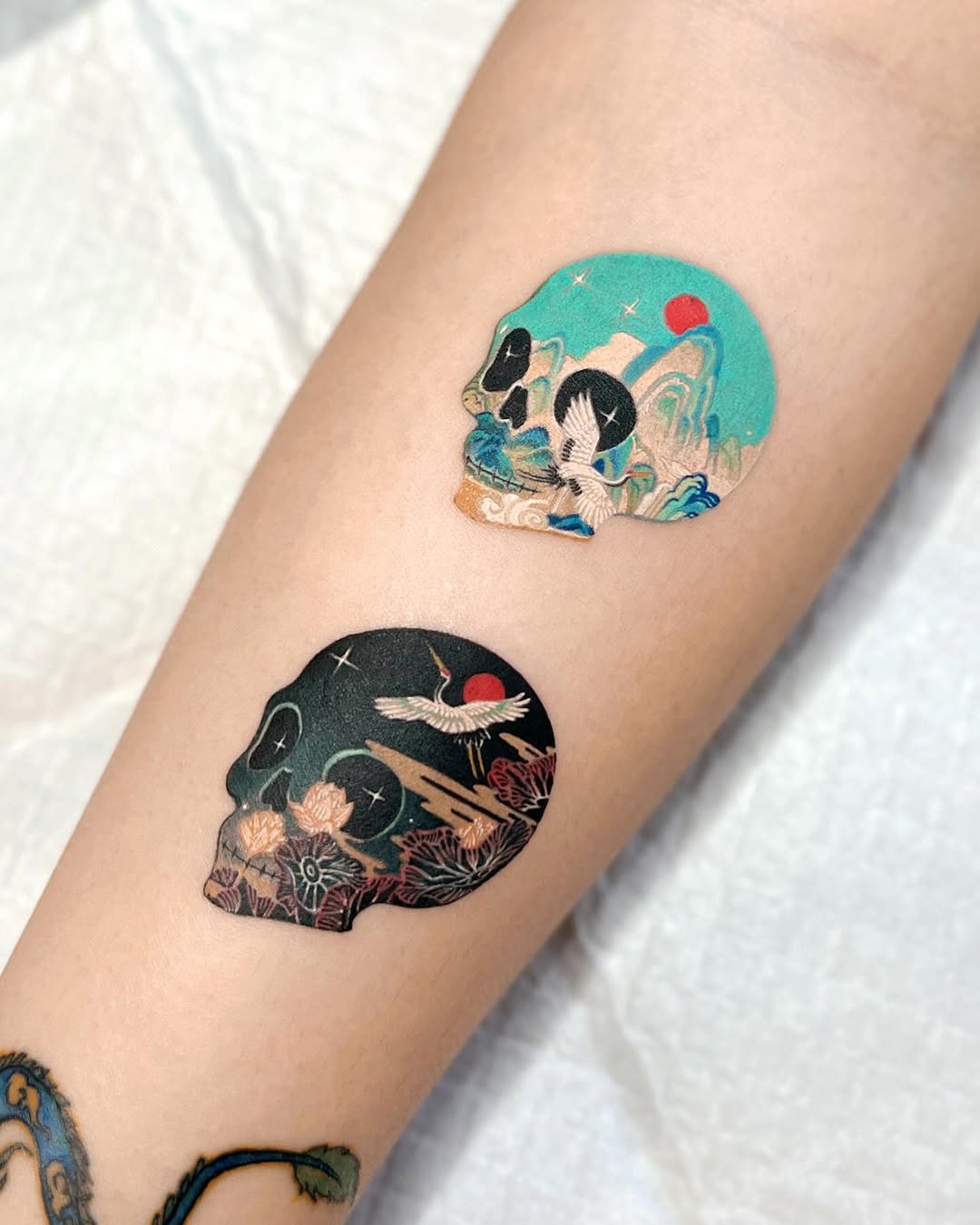 Intricate Skulls with Nature Elements Tattoo Design