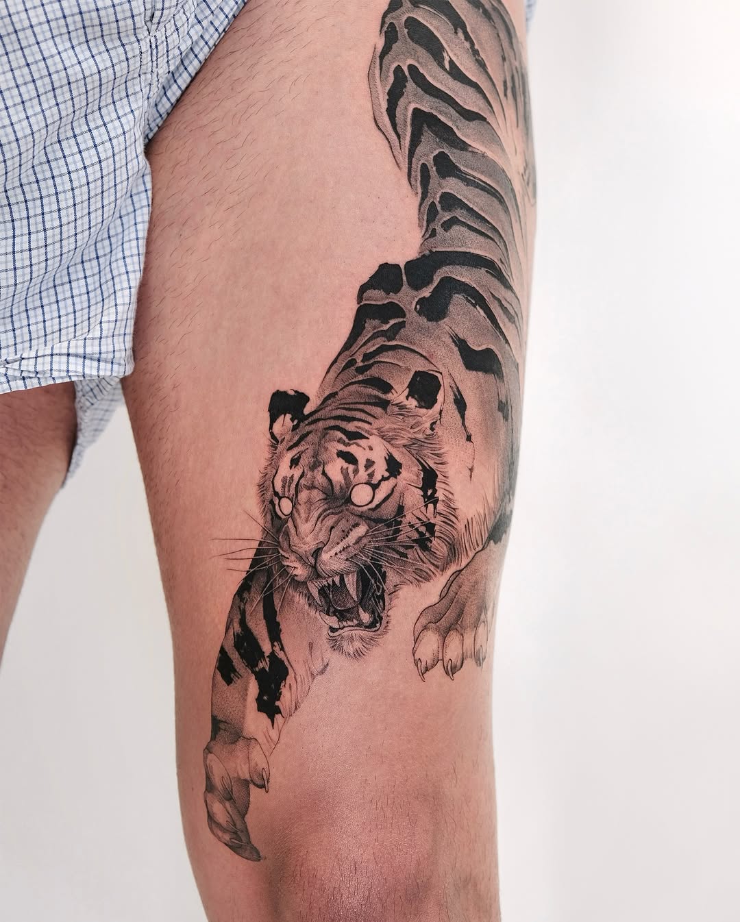 Fierce tiger tattoo design on thigh