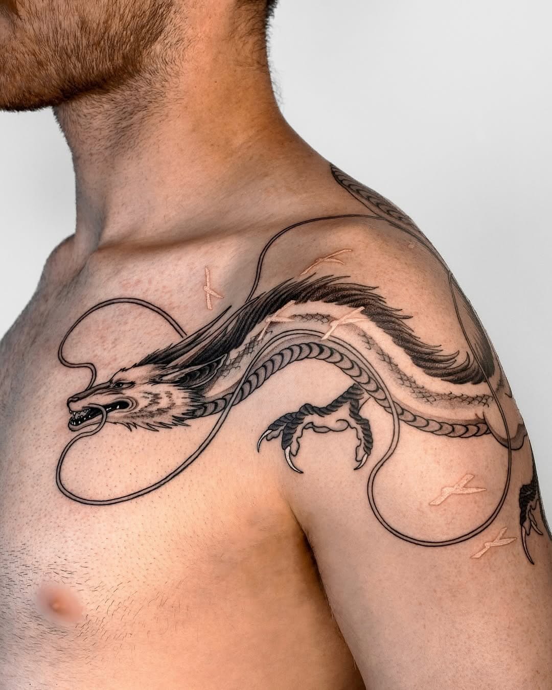 Majestic dragon tattoo design on shoulder