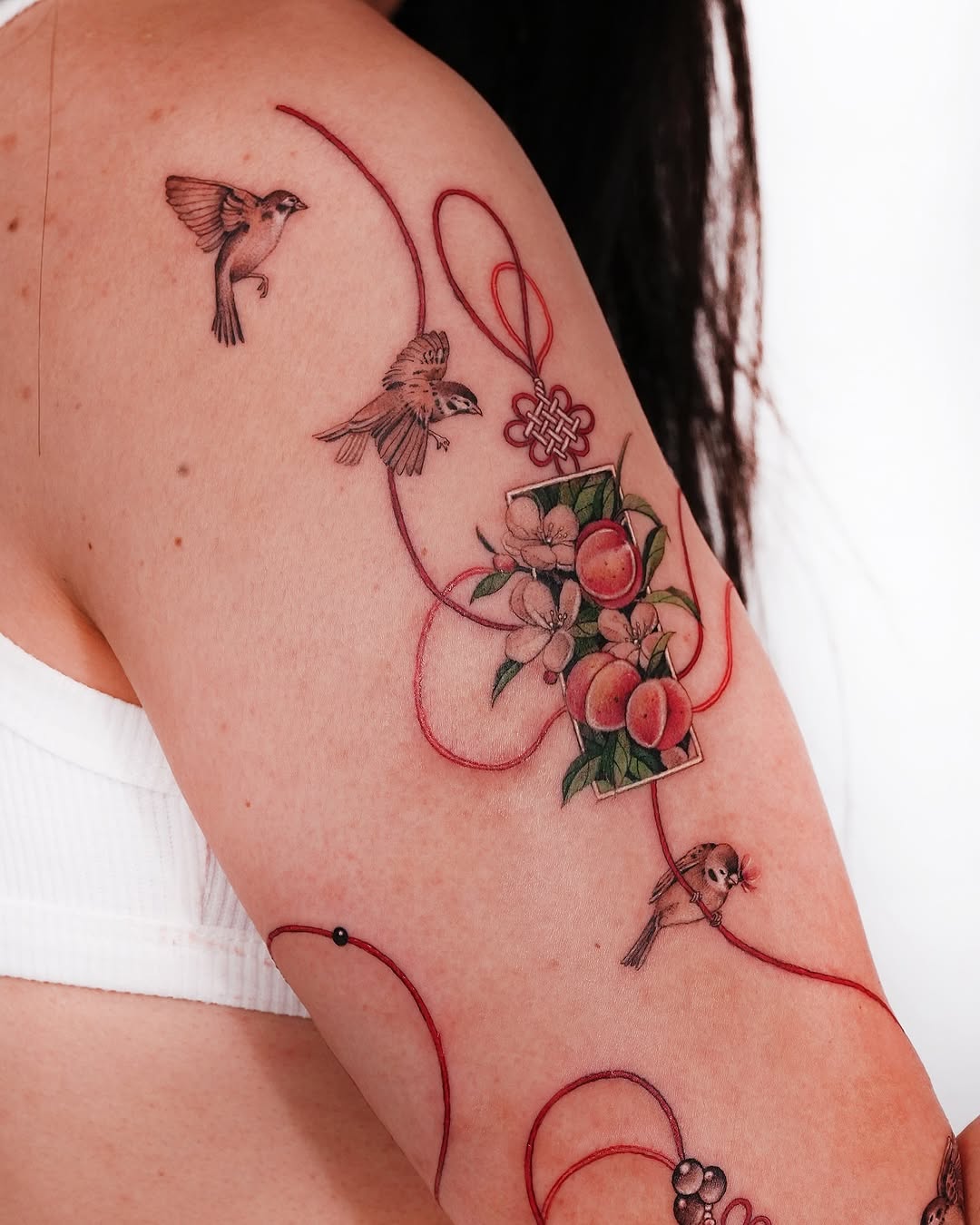 Elegant Oriental Tattoo with Birds and Peaches
