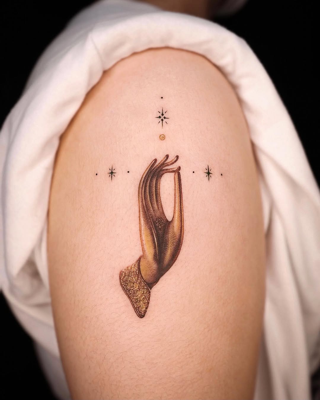 Intricate hand tattoo with celestial elements