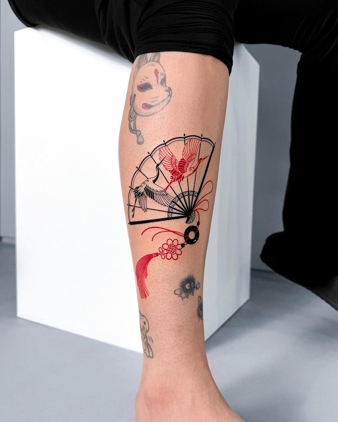 Elegant fan tattoo with a bold design