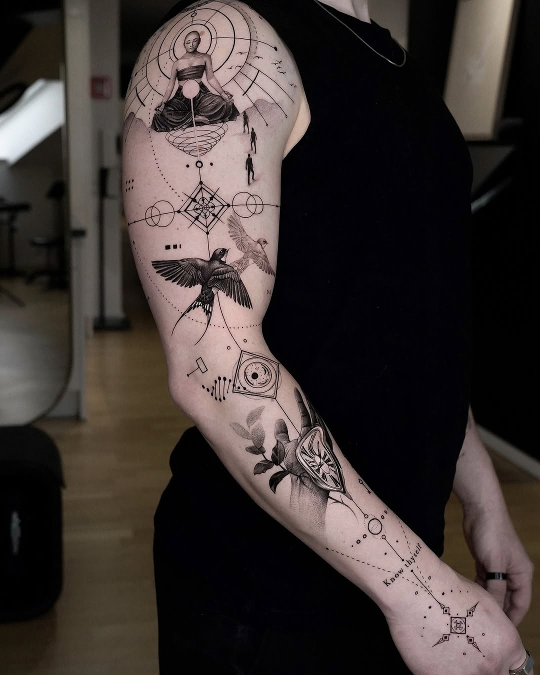 Elegant fine line tattoo with geometric elements