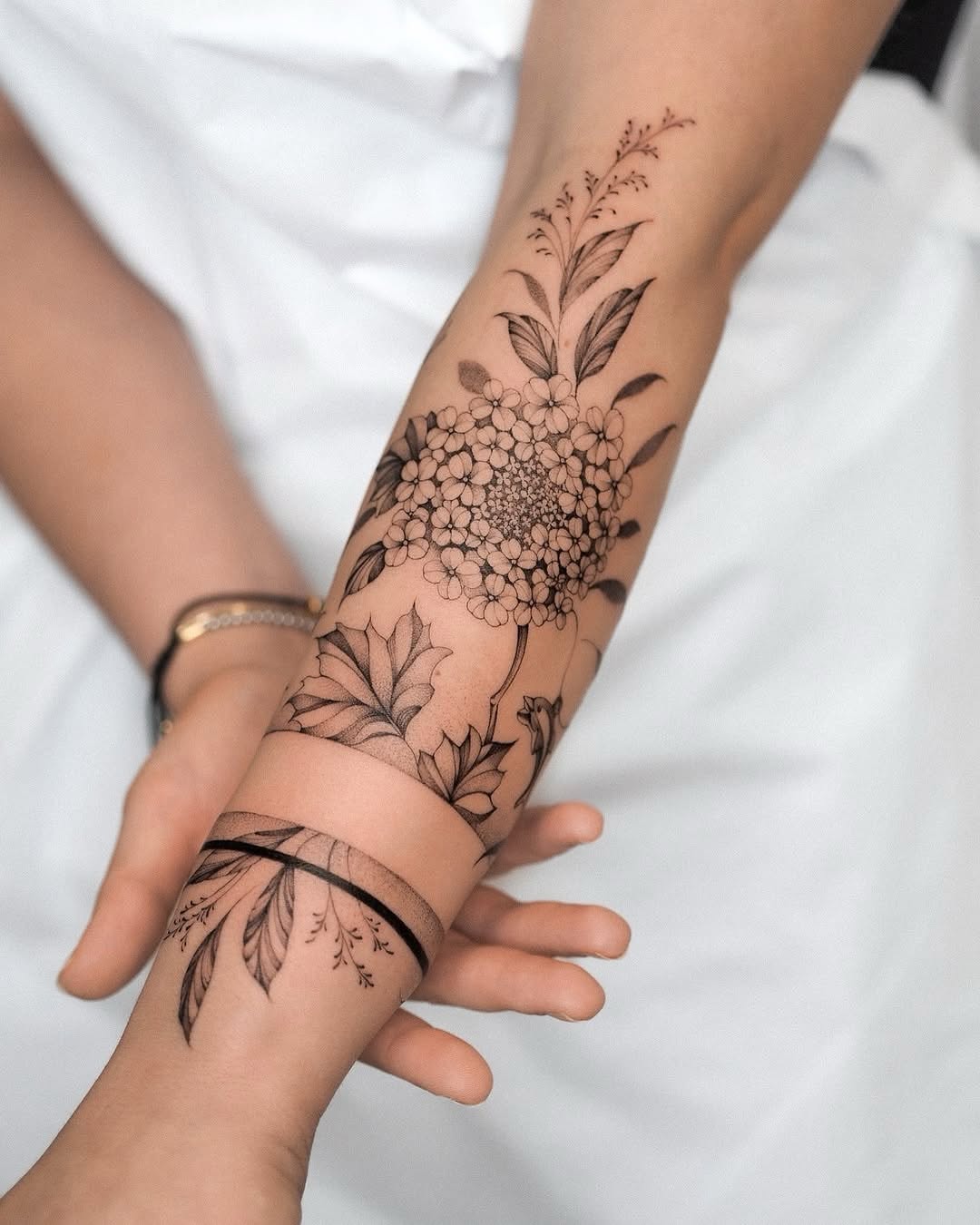 Elegant floral fine line sleeve tattoo design