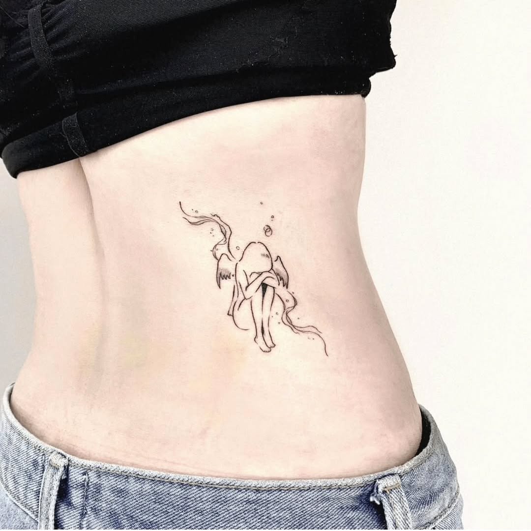 Elegant fine line tattoo on the side