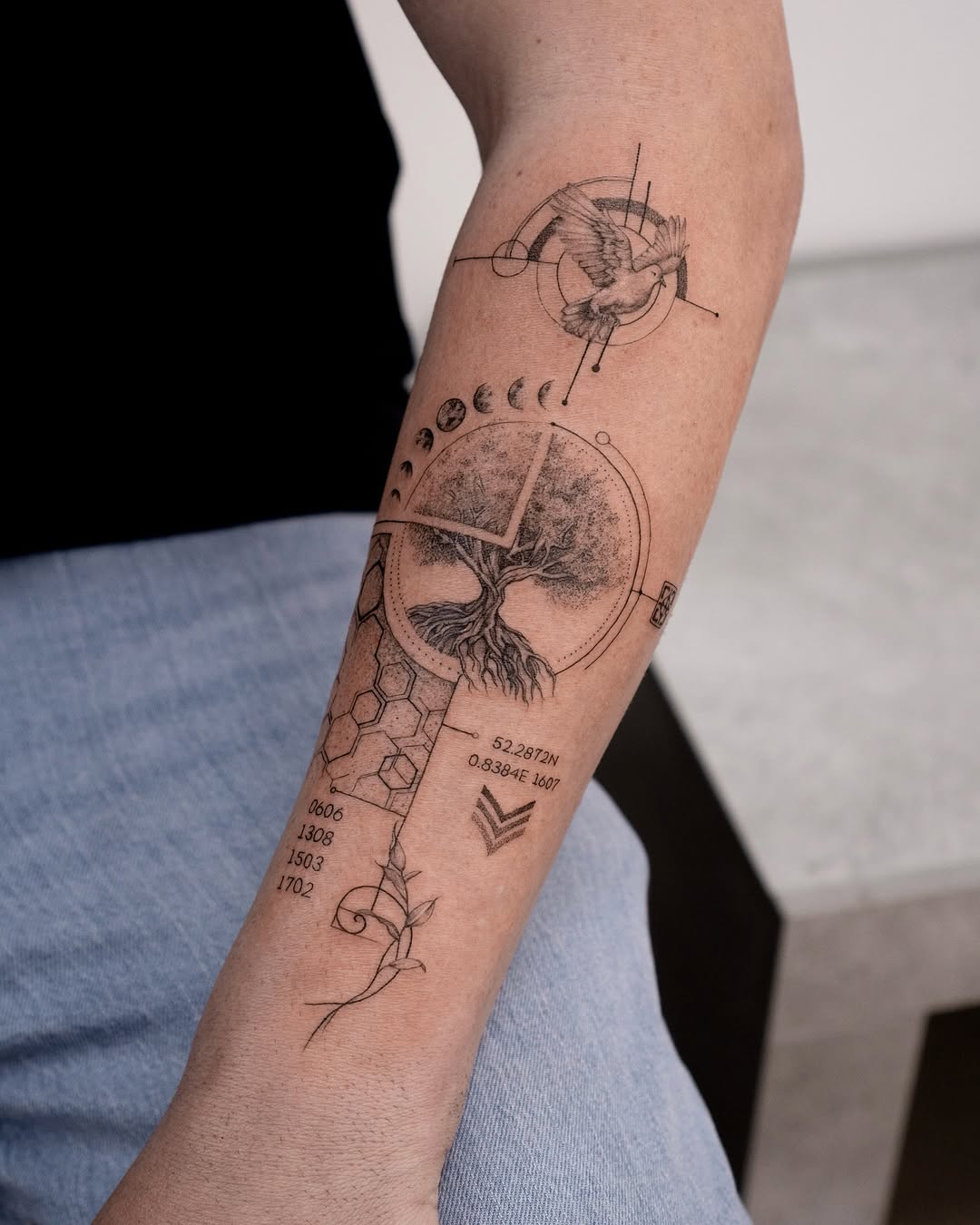 Intricate fine line tattoo of nature and coordinates