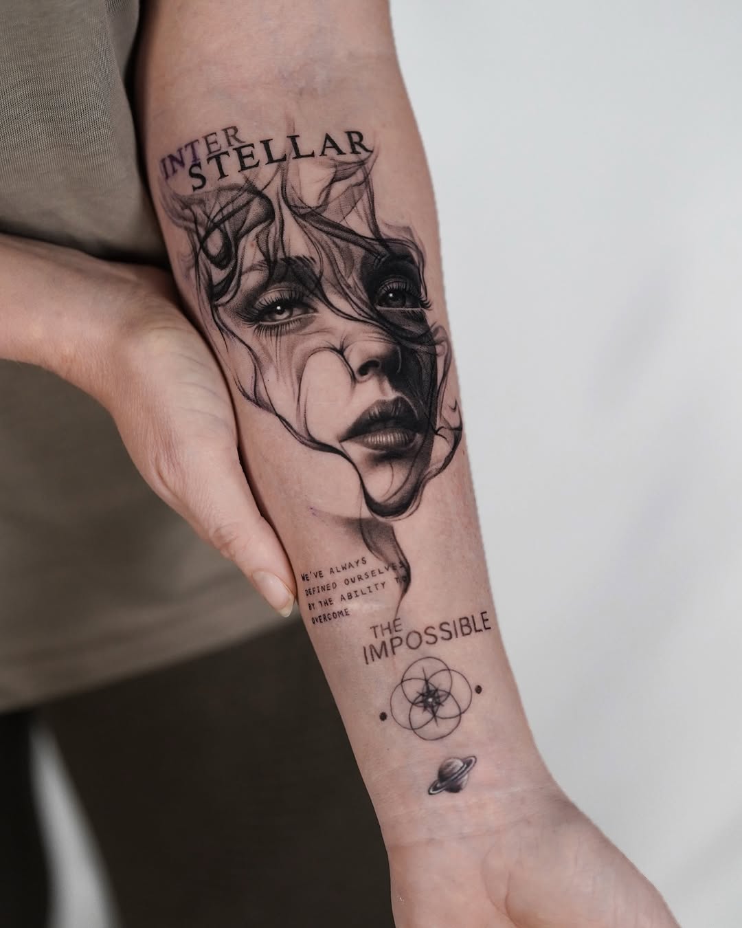 Intricate fine line tattoo blending face and quote