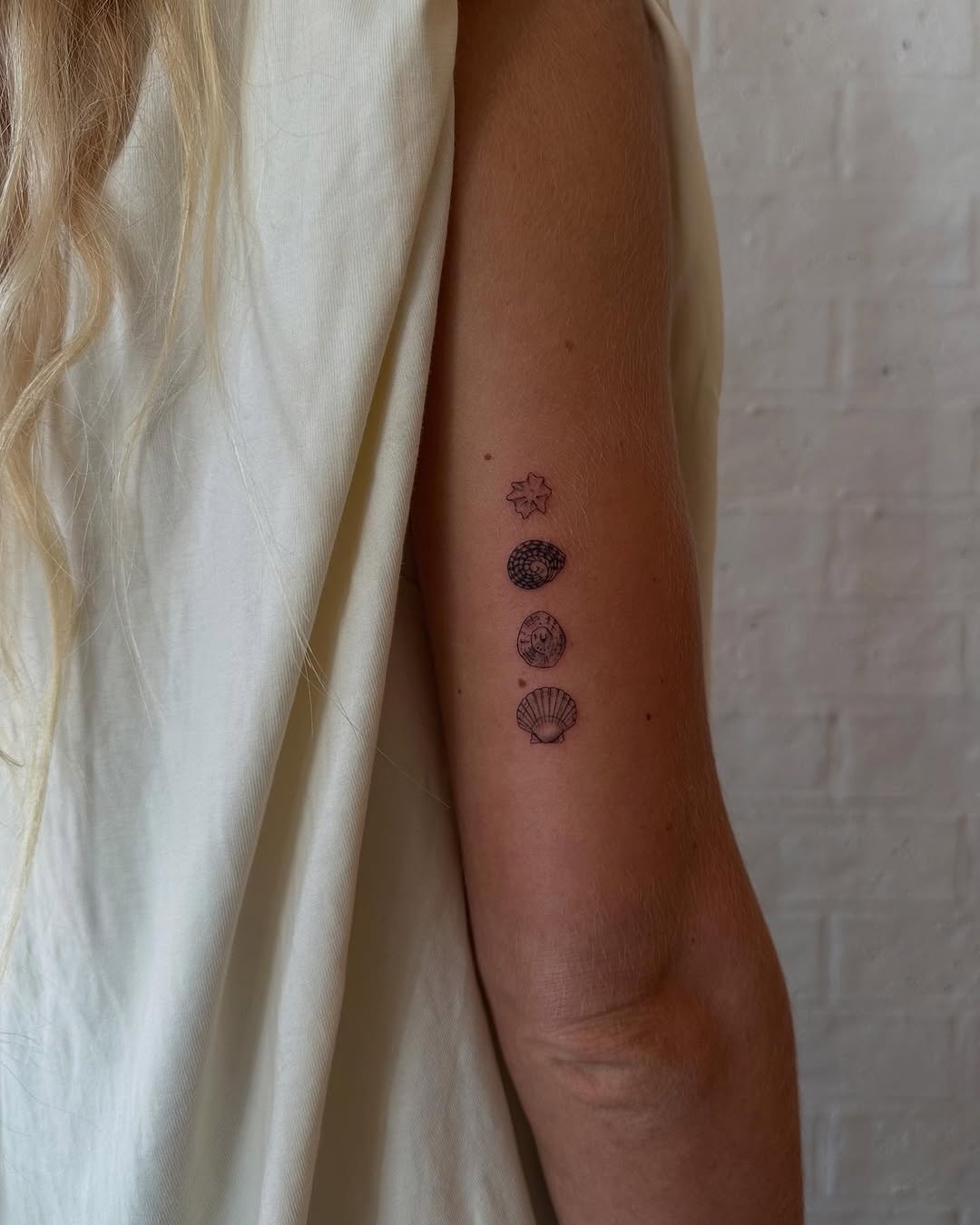Minimalist Fine Line Tattoo Collection on Arm