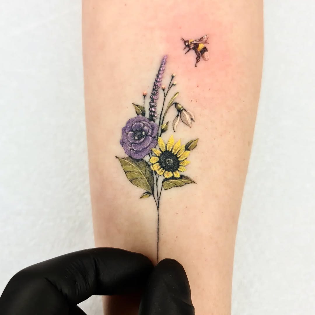 Charming floral bee tattoo with vibrant colors