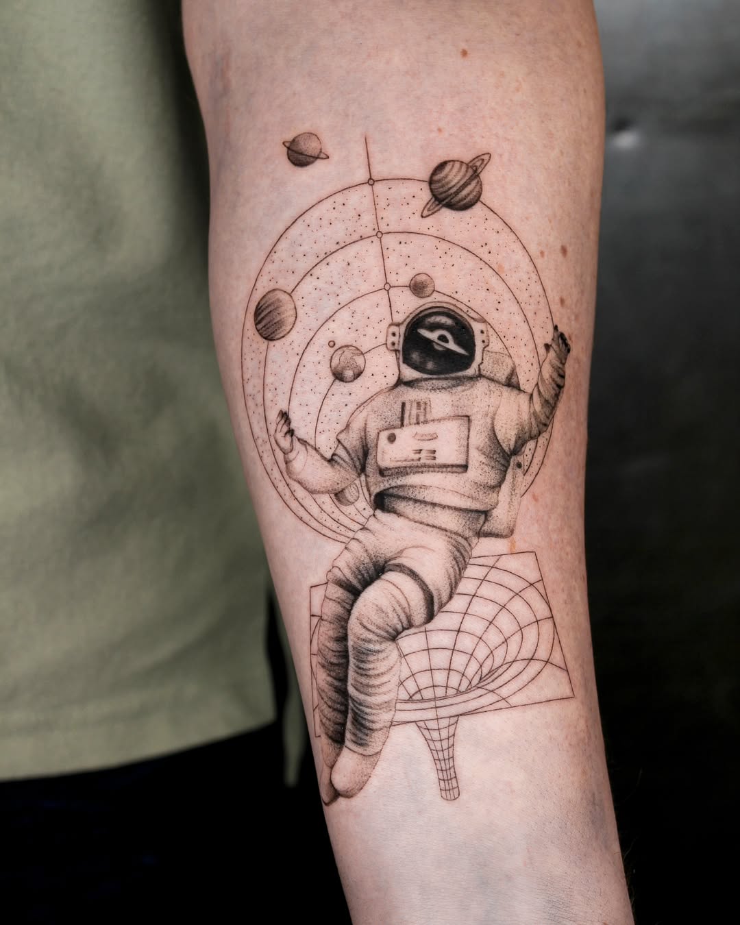 Unique Spacesuit Tattoo with Cosmic Elements