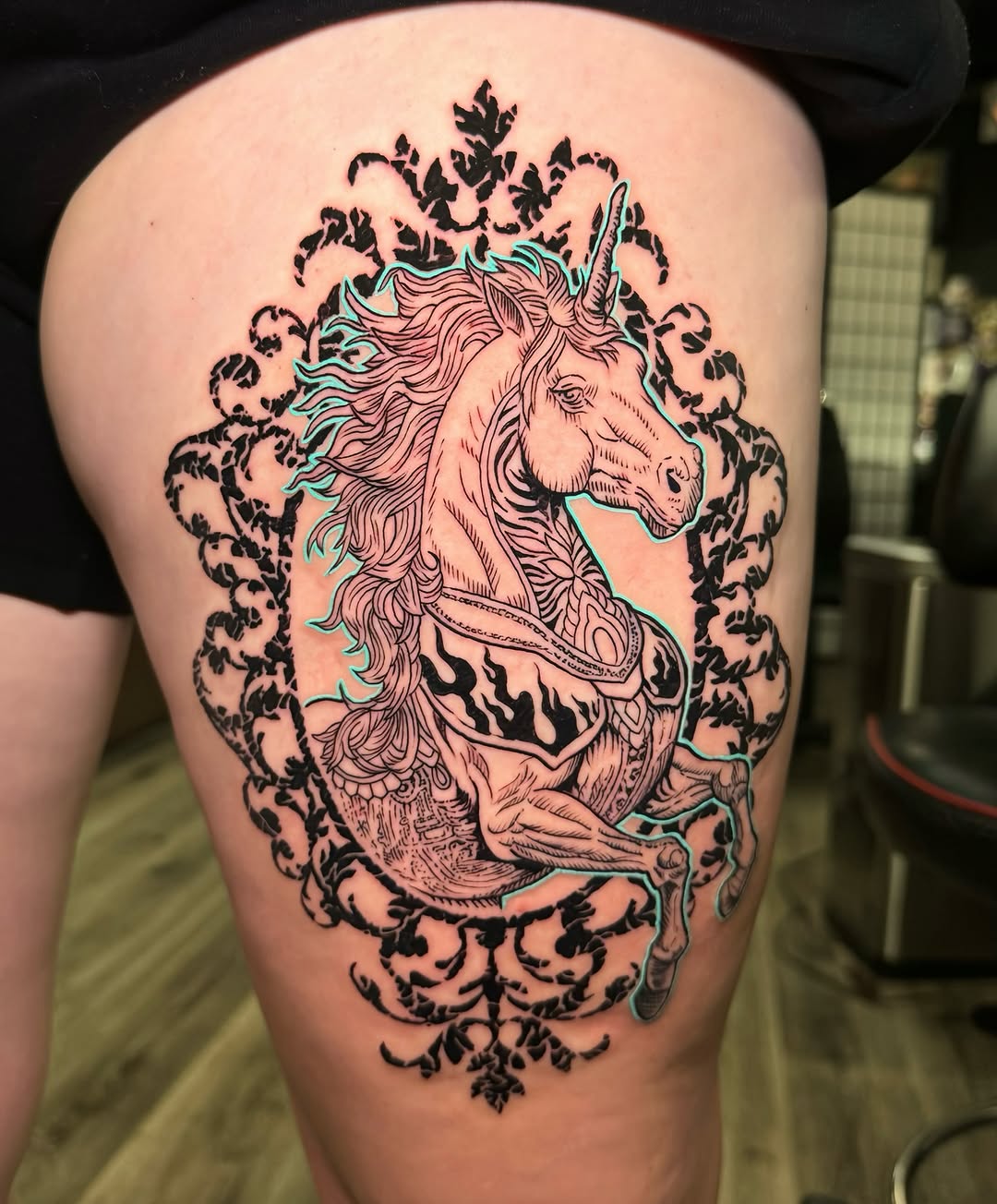 Charming unicorn tattoo with a playful design