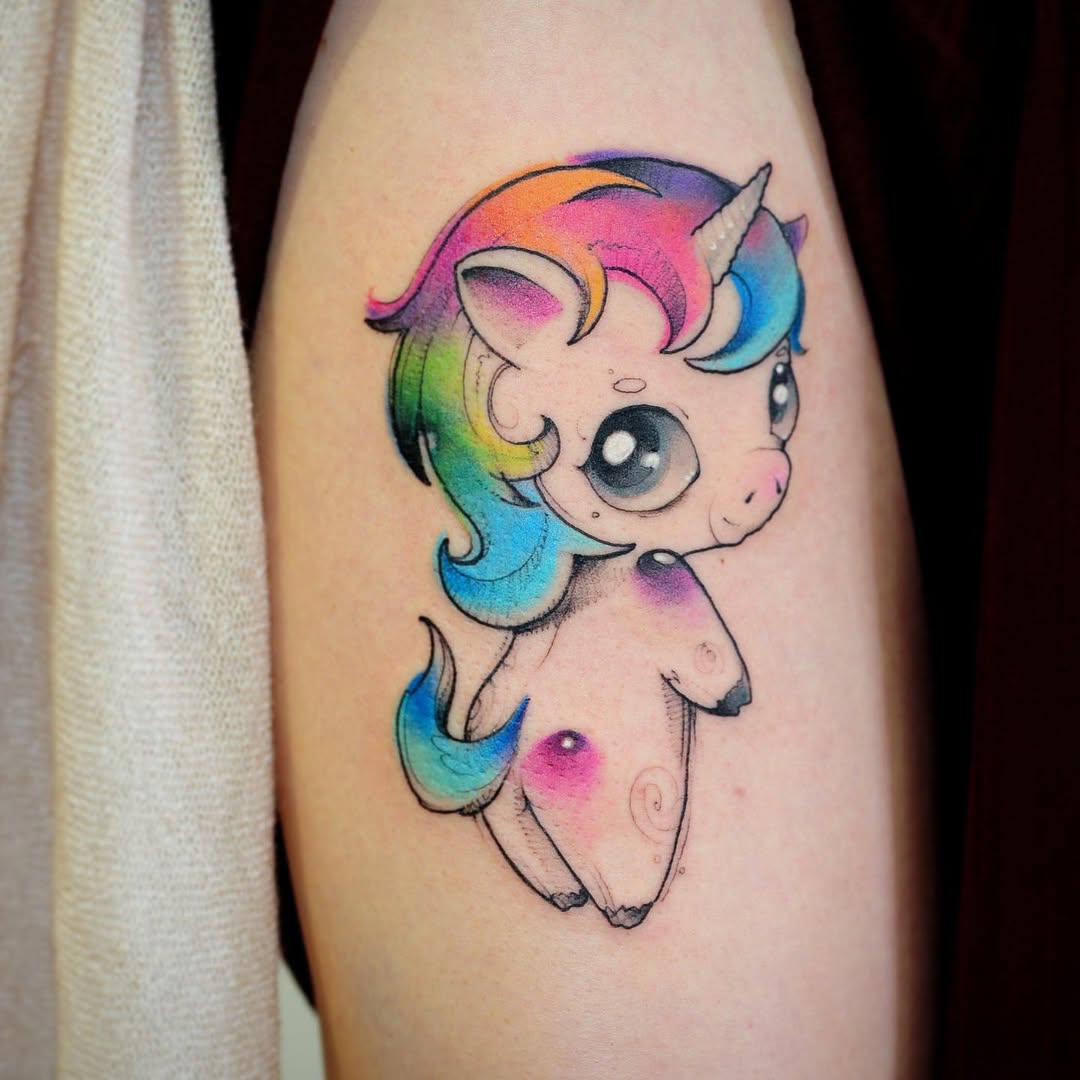 Colorful unicorn tattoo with adorable design.