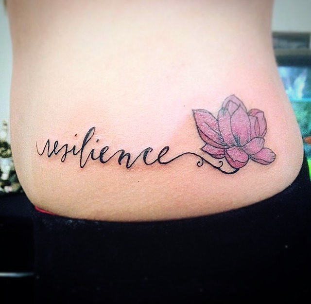 Inspiring waist tattoo celebrating resilience and growth