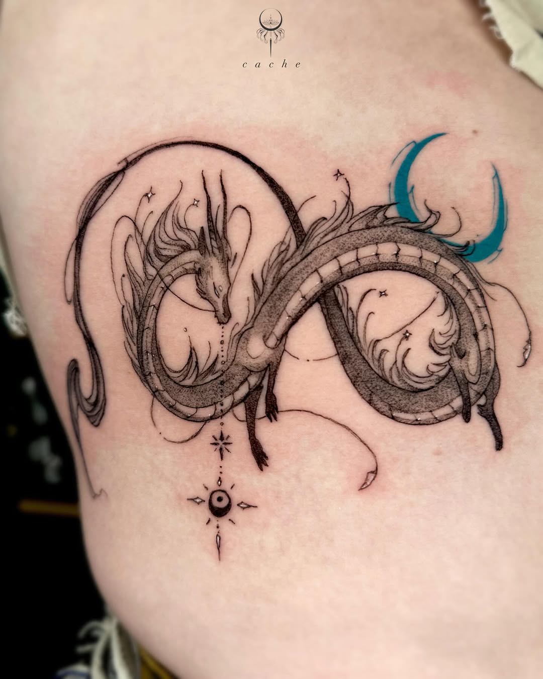Intricate dragon tattoo entwined in infinity design