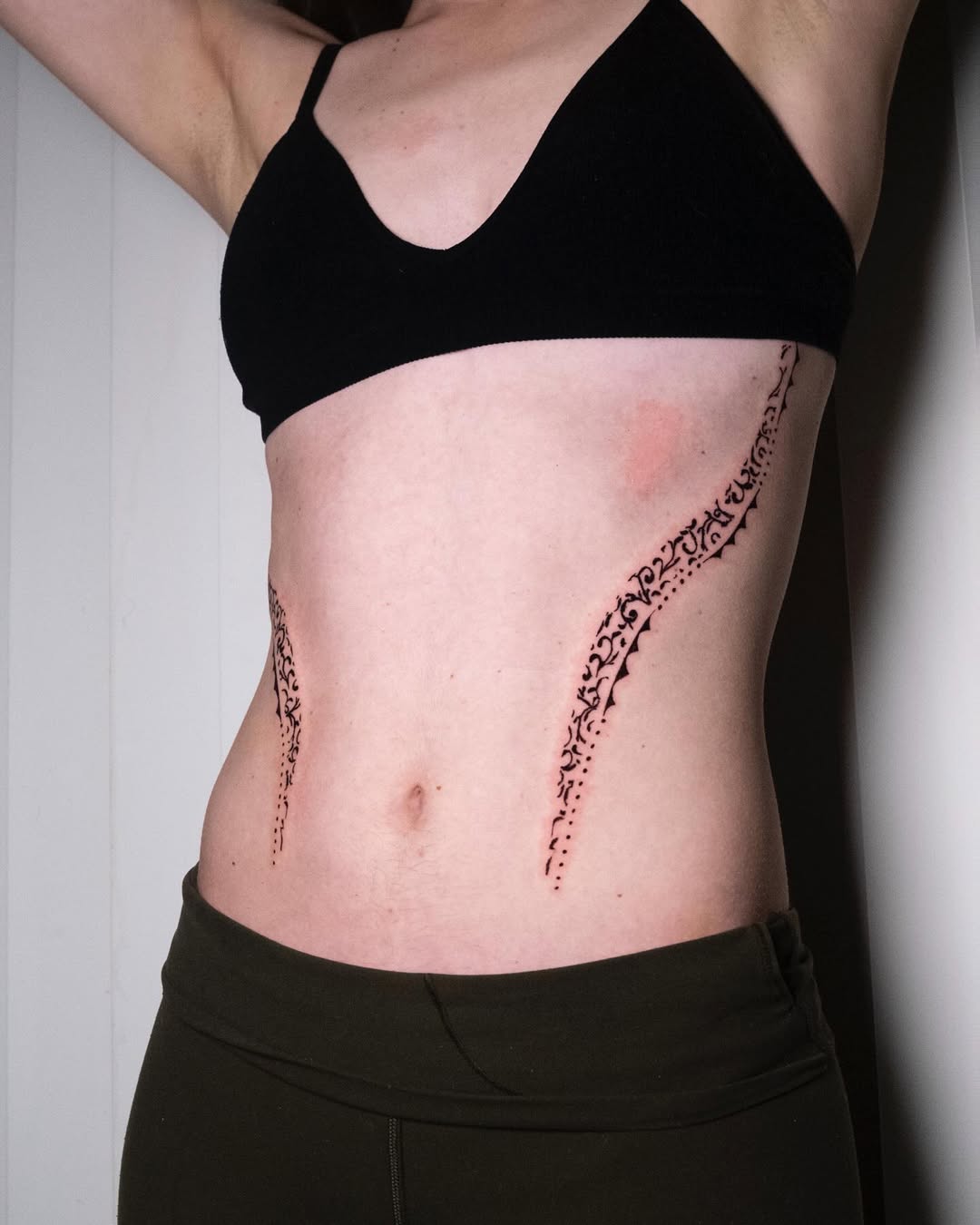 Elegant waist tattoos with intricate detailing