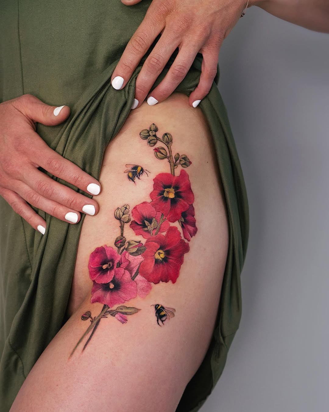 Captivating floral waist tattoo with bees
