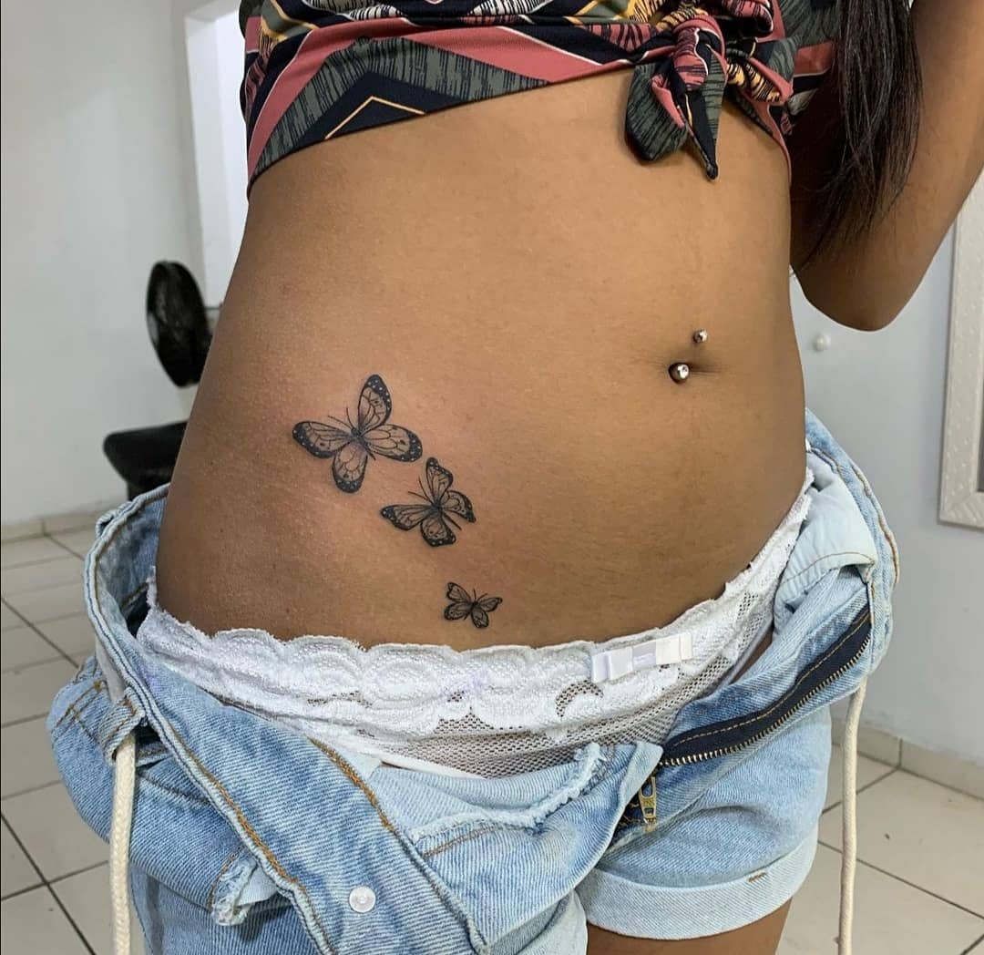Elegant butterfly tattoos enhancing waist beauty