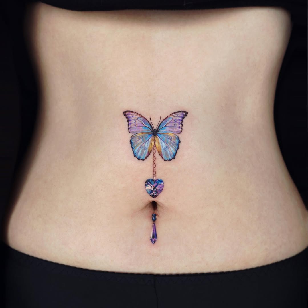 Colorful waist butterfly tattoo with hanging elements