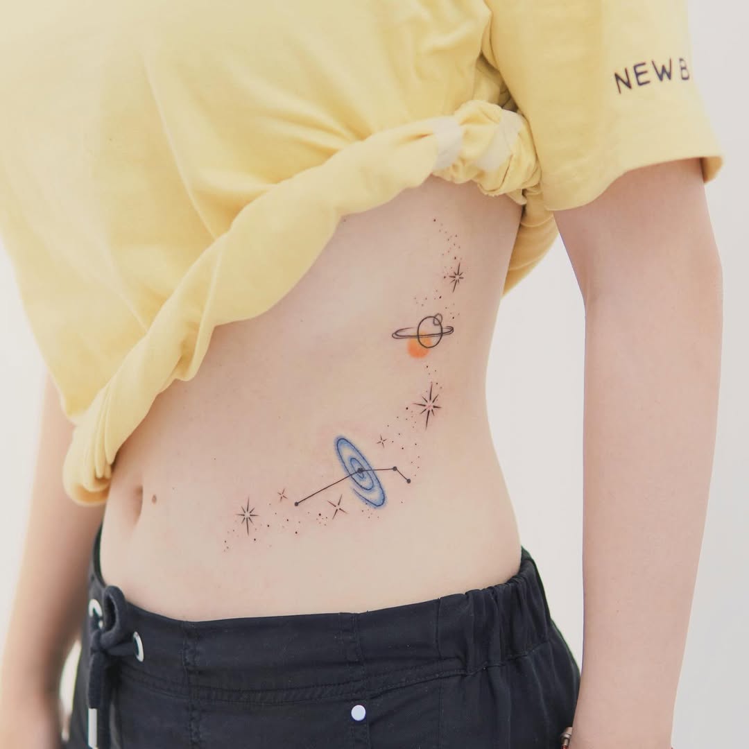 Cosmic Charm with Artistic Waist Tattoo