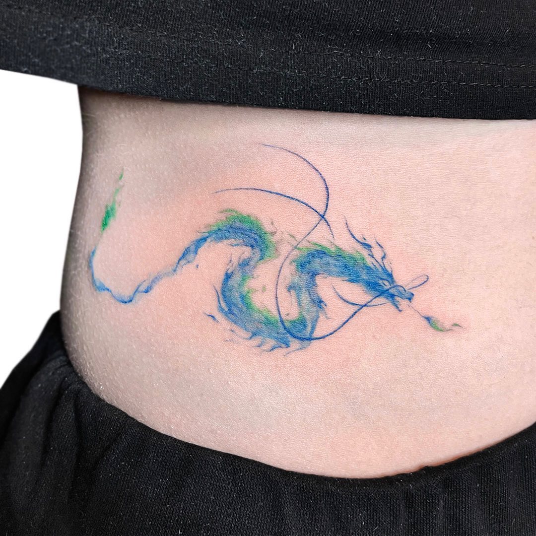 Beautiful dragon waist tattoo in vibrant colors